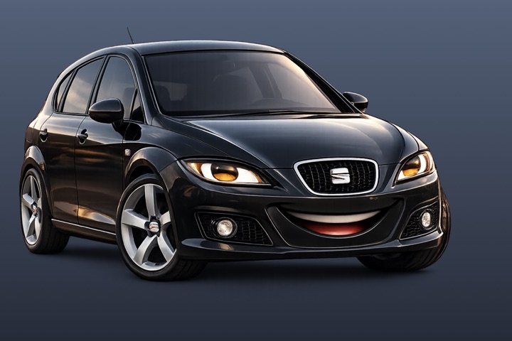 The Start Car character: a black hatchback with headlight eyes and a big smile on its bumper.